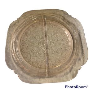 Pink depression glass plate.